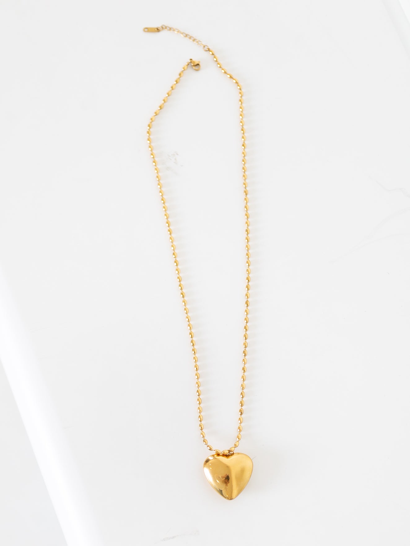 gold puffed heart necklace